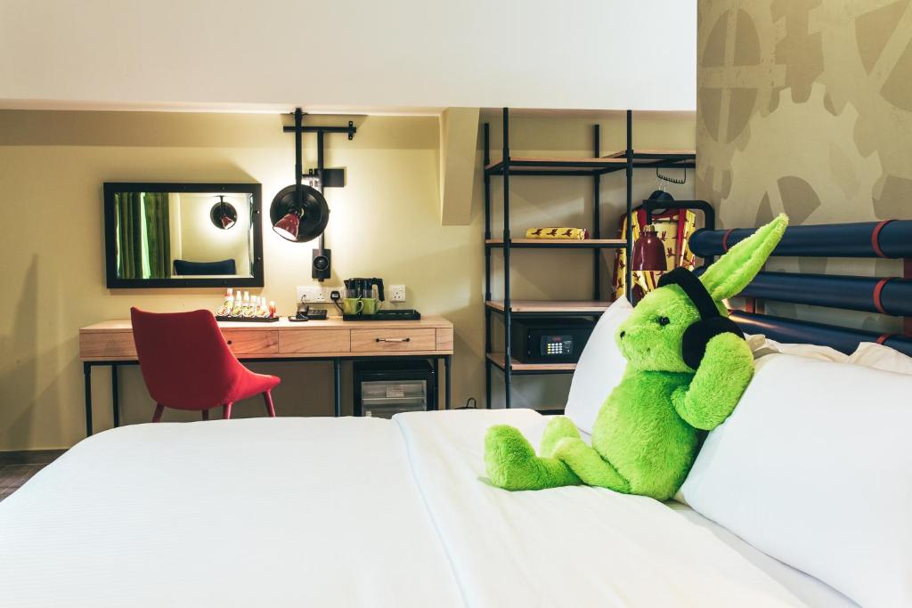 Postel nebo postele na pokoji v ubytování Dash Box Hotel Cyberjaya
