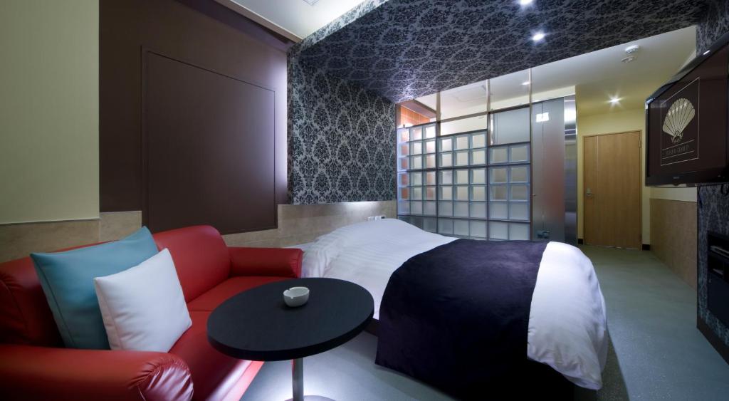 Postel nebo postele na pokoji v ubytování Hotel Glow Yokkaichi (Adult Only)