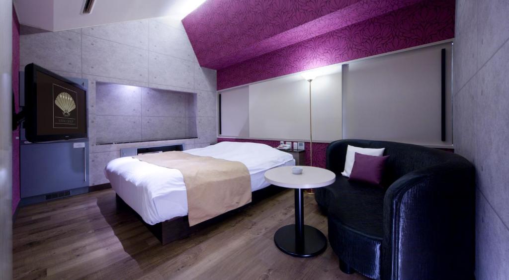 Postel nebo postele na pokoji v ubytování Hotel Glow Yokkaichi (Adult Only)