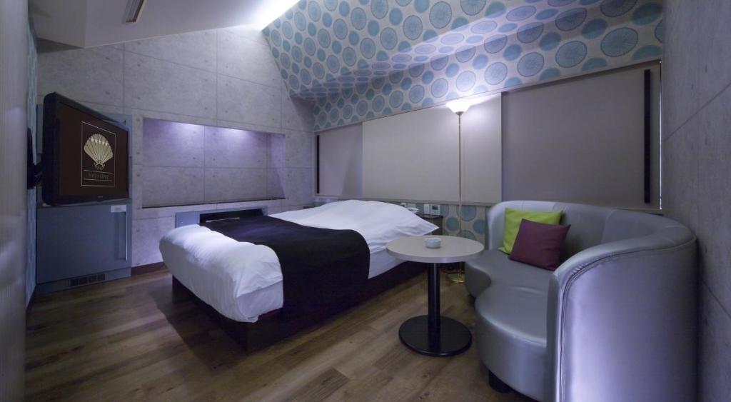 Postel nebo postele na pokoji v ubytování Hotel Glow Yokkaichi (Adult Only)