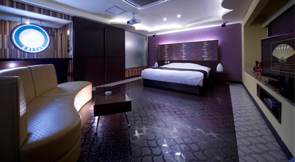 Postel nebo postele na pokoji v ubytování Hotel Glow Yokkaichi (Adult Only)