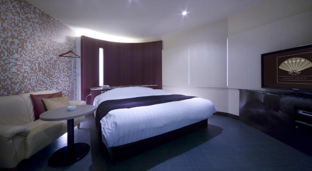 Postel nebo postele na pokoji v ubytování Hotel Glow Yokkaichi (Adult Only)