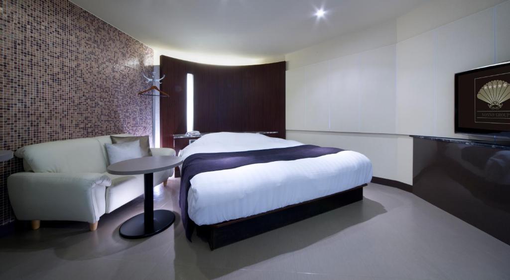 Postel nebo postele na pokoji v ubytování Hotel Glow Yokkaichi (Adult Only)