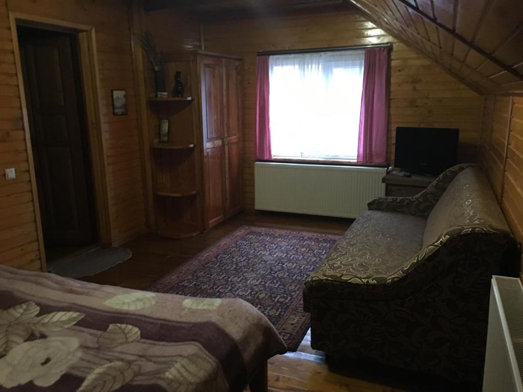 Postel nebo postele na pokoji v ubytování Барви Карпат