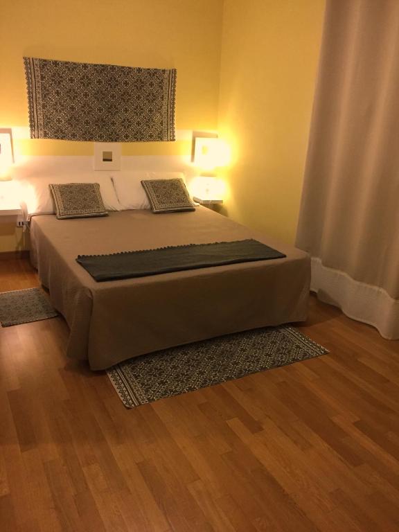 Postel nebo postele na pokoji v ubytování RESIDENZA SERENA B&B -Centro Storico
