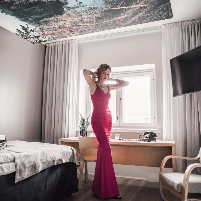 Postel nebo postele na pokoji v ubytování Hotel Helka