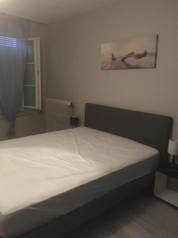 Postel nebo postele na pokoji v ubytování L’AMIRAL