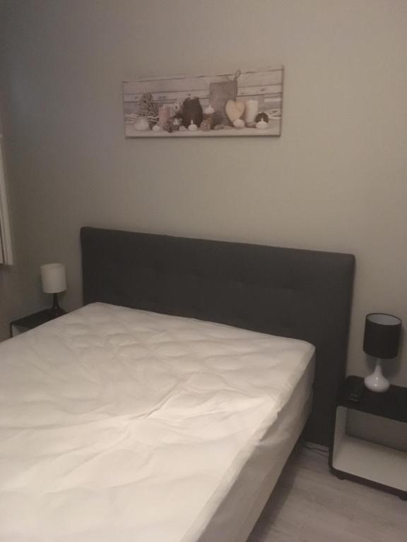 Postel nebo postele na pokoji v ubytování L’AMIRAL