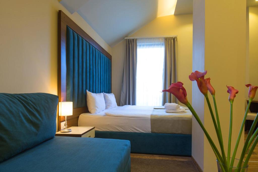 Postel nebo postele na pokoji v ubytování Marquise Hotel Garni