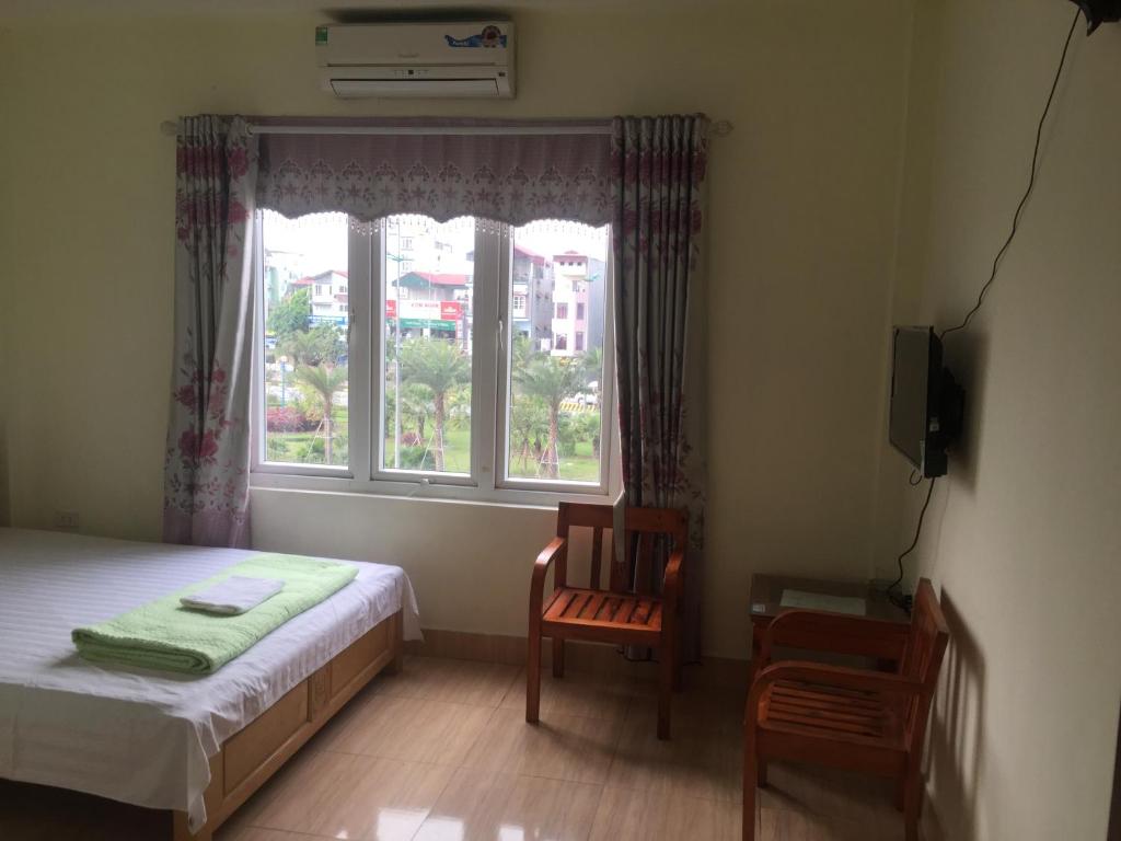 Postel nebo postele na pokoji v ubytování Nhà Nghỉ Diễm Quỳnh