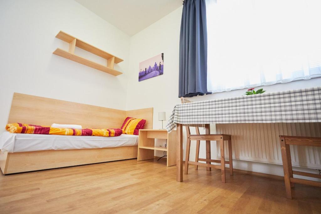 Postel nebo postele na pokoji v ubytování University Hotel