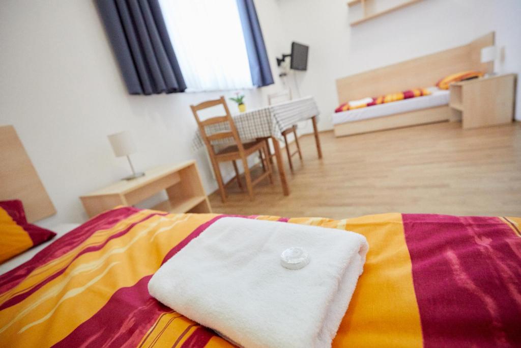 Postel nebo postele na pokoji v ubytování University Hotel