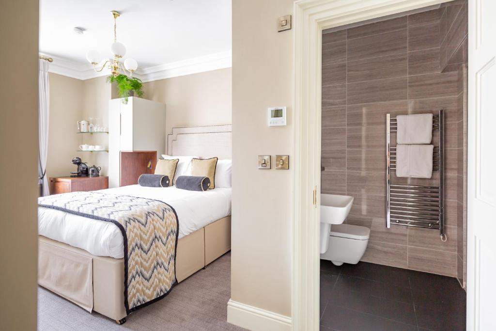 Posteľ alebo postele v izbe v ubytovaní Trinity Townhouse Hotel