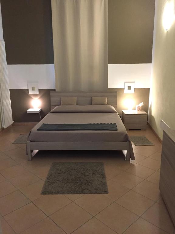 Postel nebo postele na pokoji v ubytování RESIDENZA SERENA B&B -Centro Storico