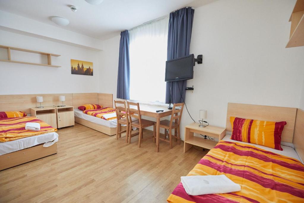 Postel nebo postele na pokoji v ubytování University Hotel