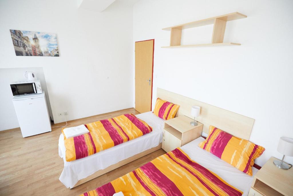 Postel nebo postele na pokoji v ubytování University Hotel