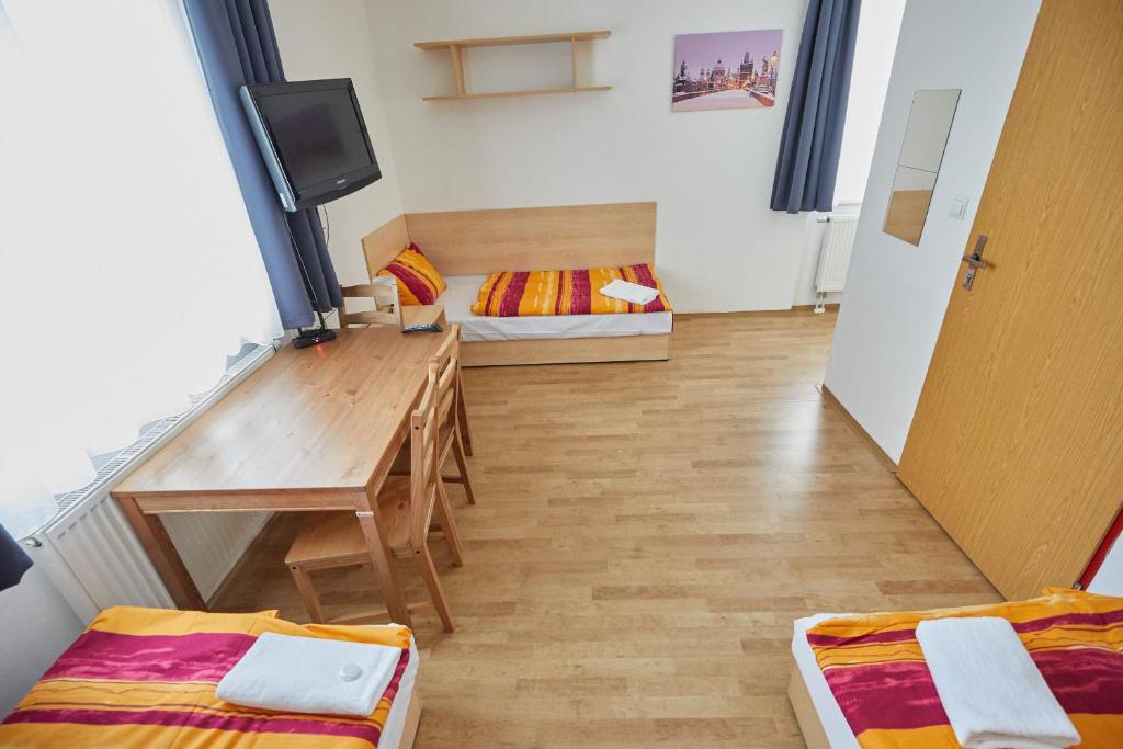 Postel nebo postele na pokoji v ubytování University Hotel
