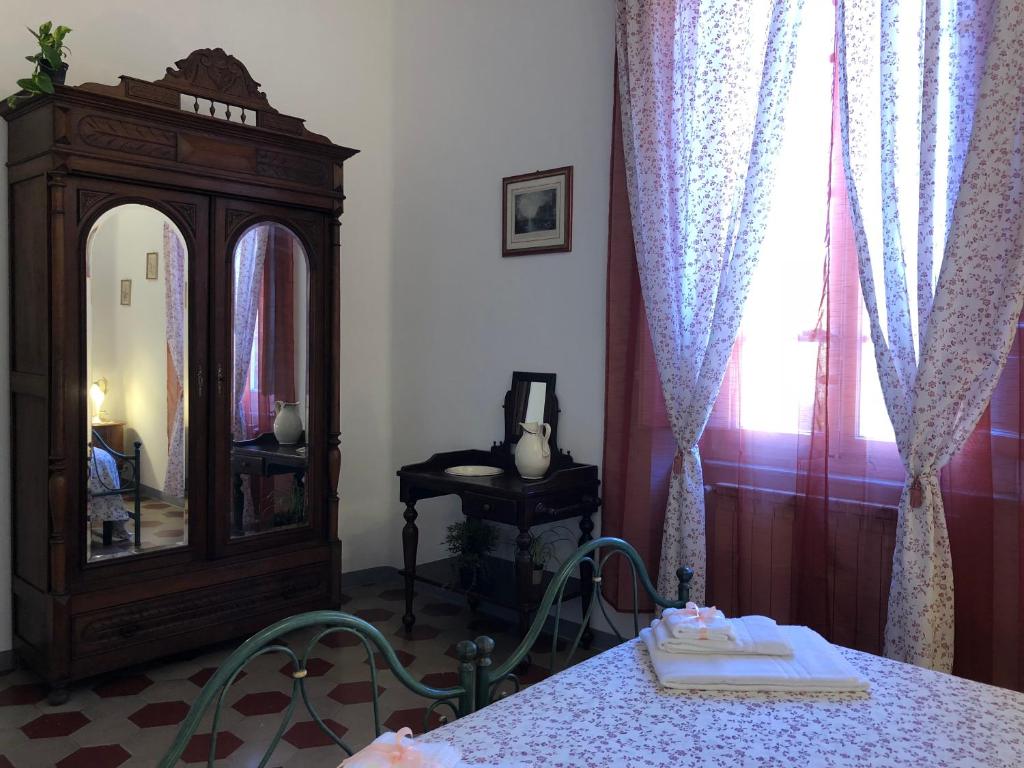A bed or beds in a room at Relais Puccini