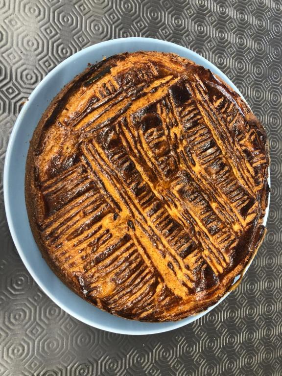a cake on a plate on a table at Hotel-Restaurant Lann Roz / Côte Cuisine in Carnac