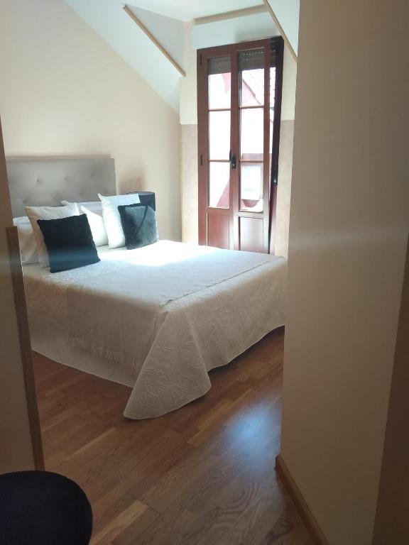 Posteľ alebo postele v izbe v ubytovaní Apartamento Conde Luna