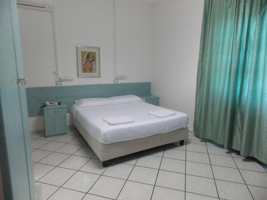 Postel nebo postele na pokoji v ubytování Hotel Villa dei Butteri - Aprilia