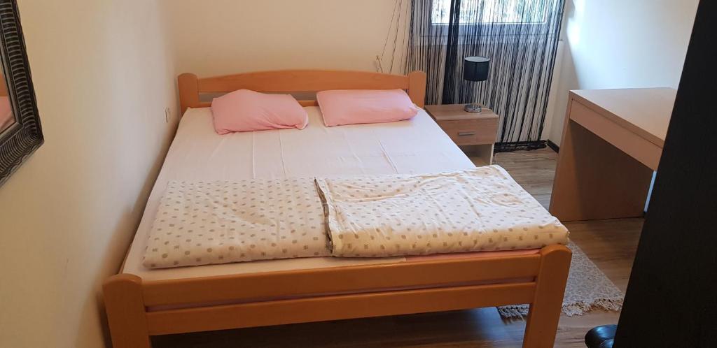 Postel nebo postele na pokoji v ubytování Apartments Agape