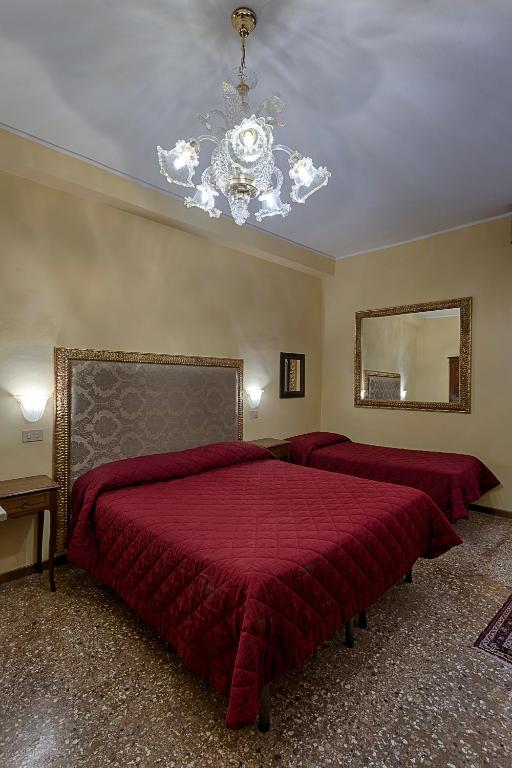 Postel nebo postele na pokoji v ubytování Hotel Guerrato