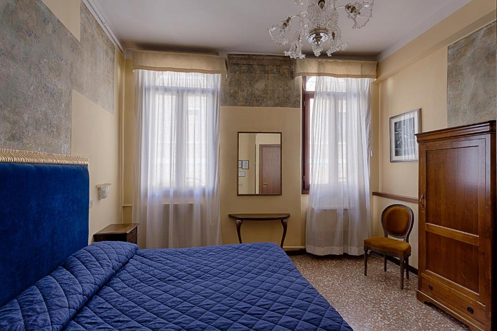 Postel nebo postele na pokoji v ubytování Hotel Guerrato