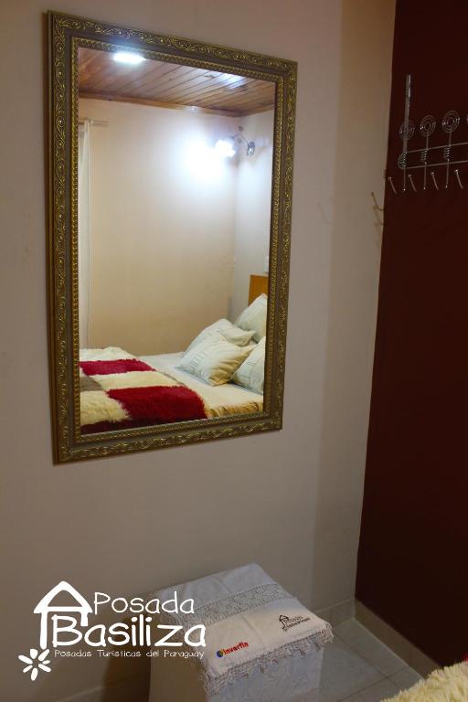 Cama o camas de una habitación en Posada Basiliza, Encarnación PY