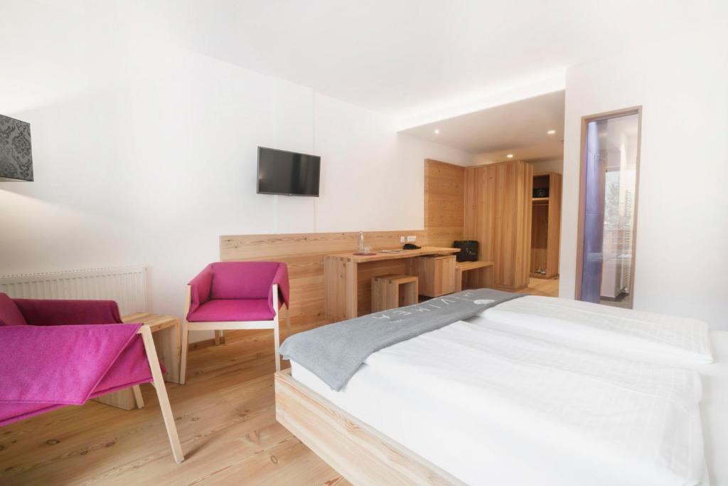 Postel nebo postele na pokoji v ubytování Vegan Hotel La Vimea