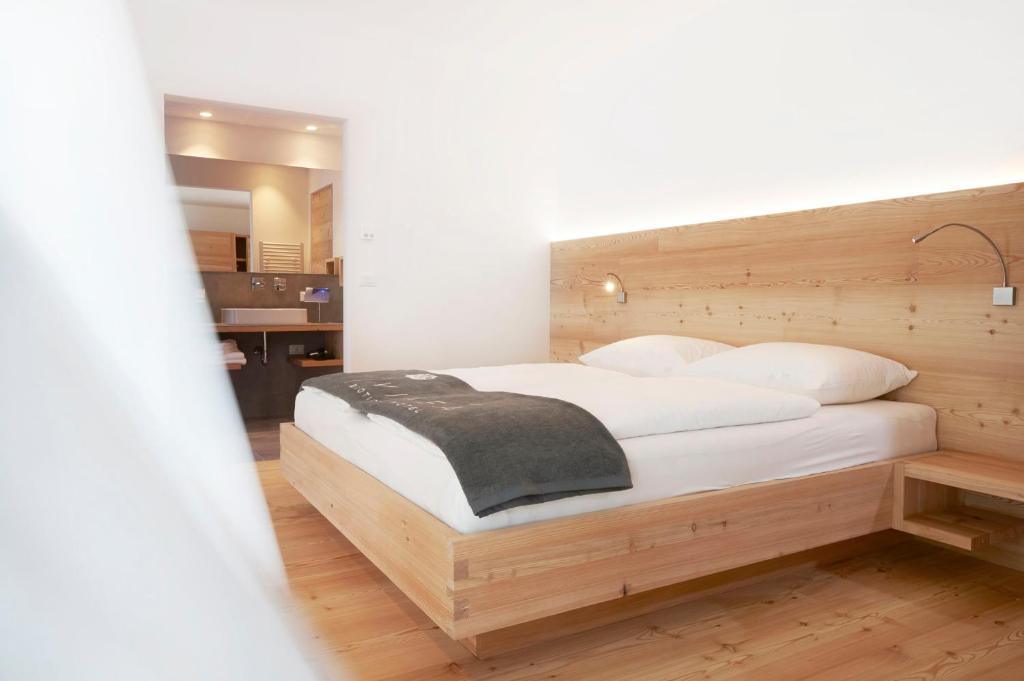 Postel nebo postele na pokoji v ubytování Vegan Hotel La Vimea