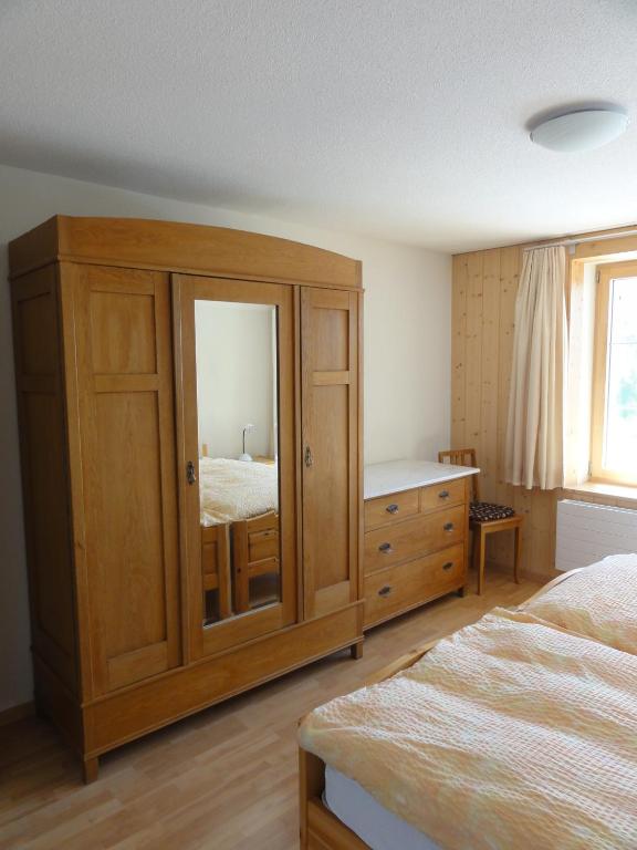 Postel nebo postele na pokoji v ubytování Chalet Schönbühl