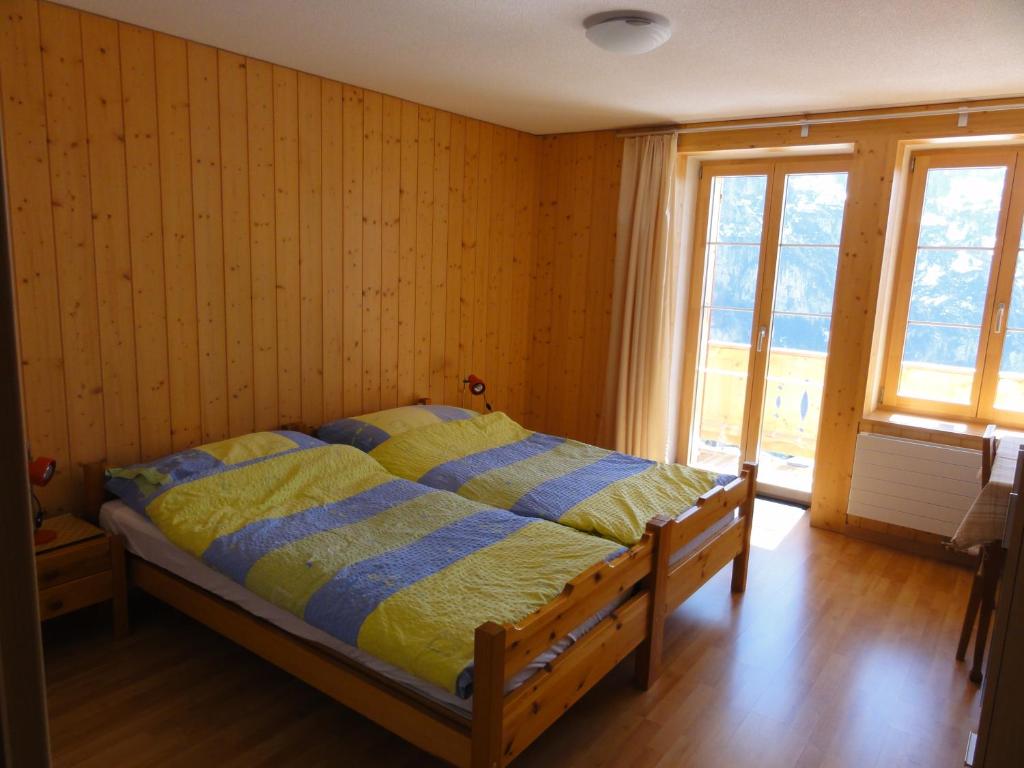 En eller flere senger på et rom på Chalet Schönbühl
