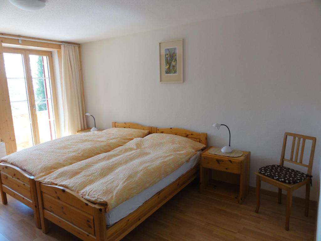 Postel nebo postele na pokoji v ubytování Chalet Schönbühl
