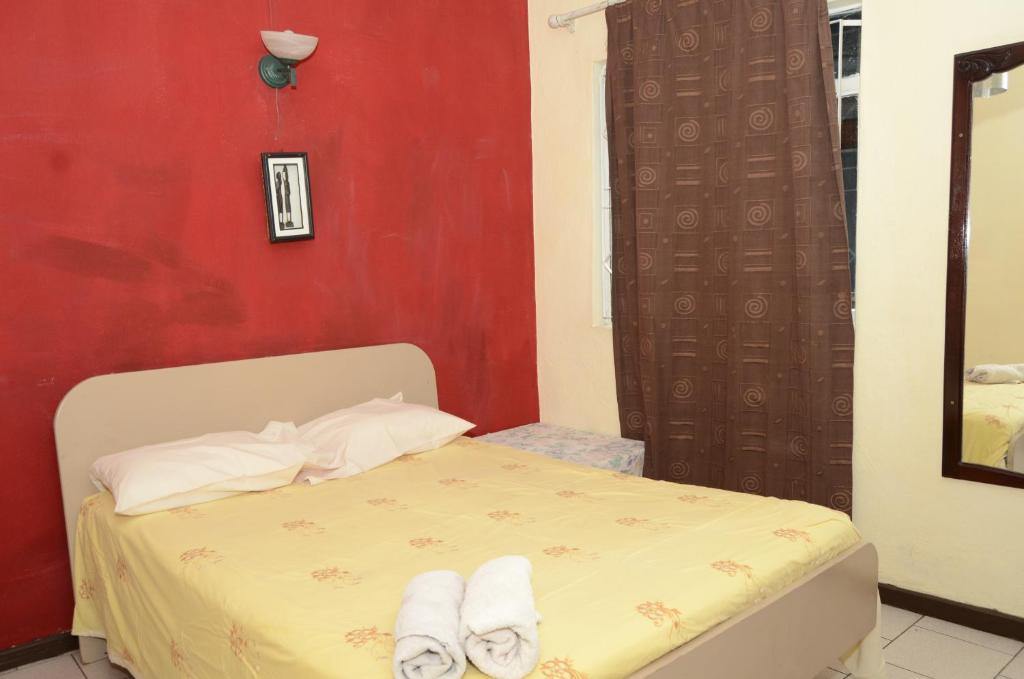 Postel nebo postele na pokoji v ubytování Dookee House