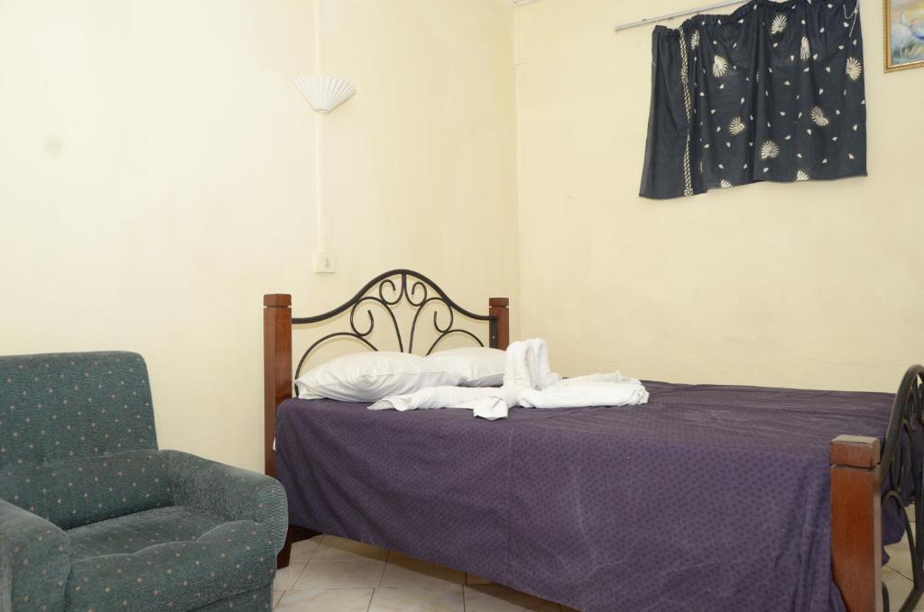 Postel nebo postele na pokoji v ubytování Dookee House