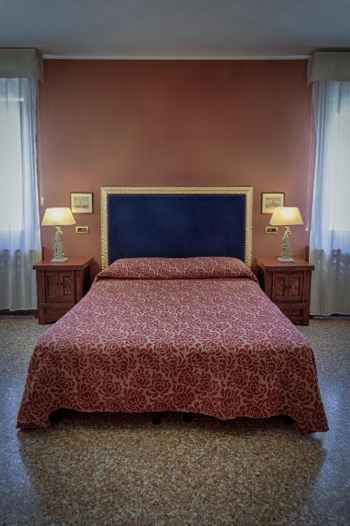 Postel nebo postele na pokoji v ubytování Hotel Guerrato