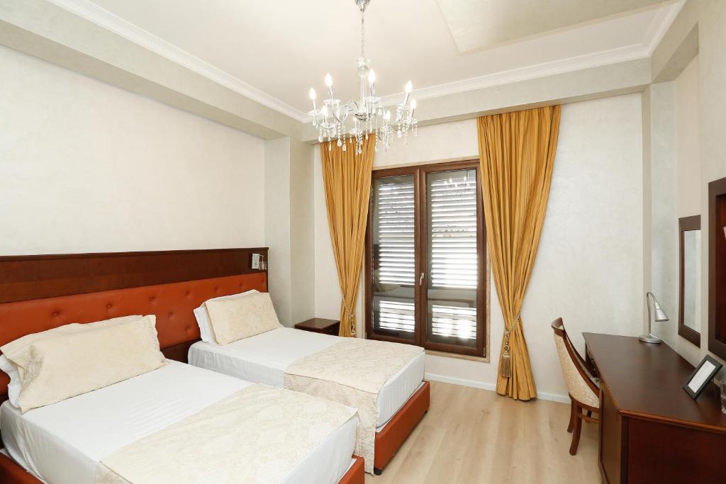 Postel nebo postele na pokoji v ubytování Oxford hotel
