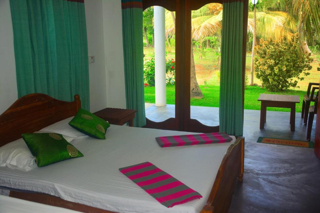Postel nebo postele na pokoji v ubytování Hideaway Homestay Habarana