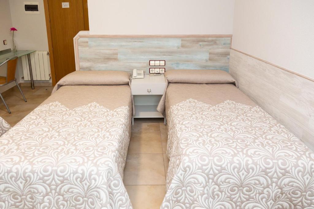 Voodi või voodid majutusasutuse Hostal Viky toas