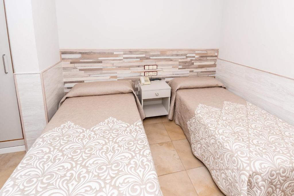 Voodi või voodid majutusasutuse Hostal Viky toas