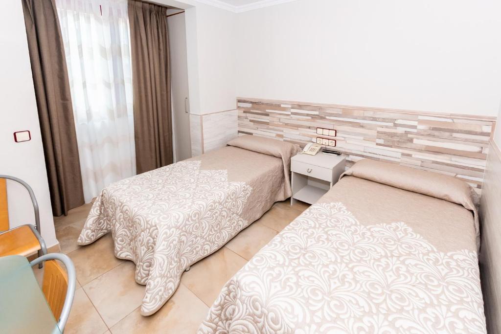 Voodi või voodid majutusasutuse Hostal Viky toas