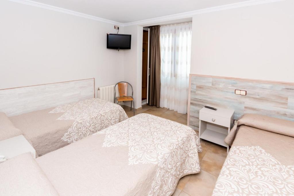 Voodi või voodid majutusasutuse Hostal Viky toas