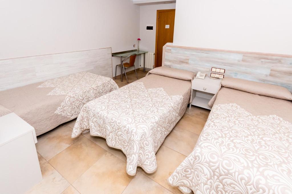 Voodi või voodid majutusasutuse Hostal Viky toas