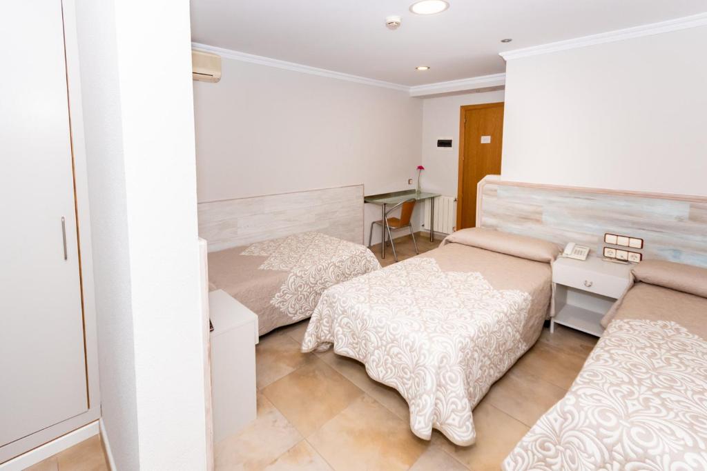 Voodi või voodid majutusasutuse Hostal Viky toas