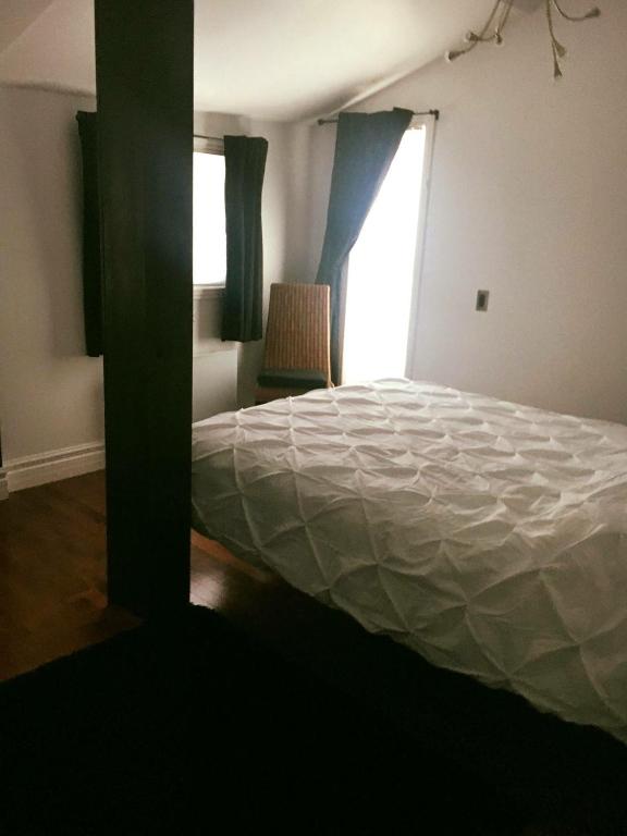 Postel nebo postele na pokoji v ubytování Suites North Hatley