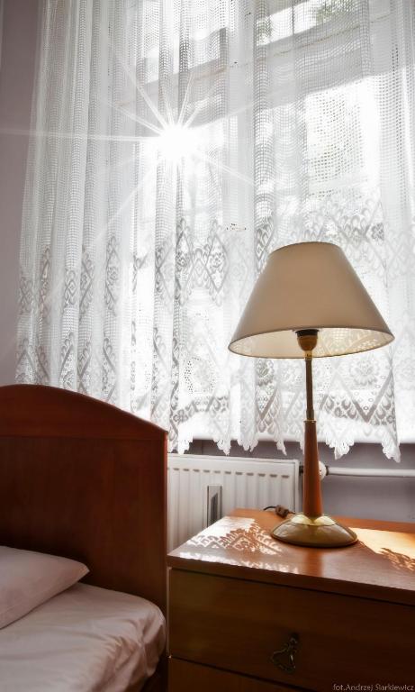 Postel nebo postele na pokoji v ubytování DS Cztery Pory Roku