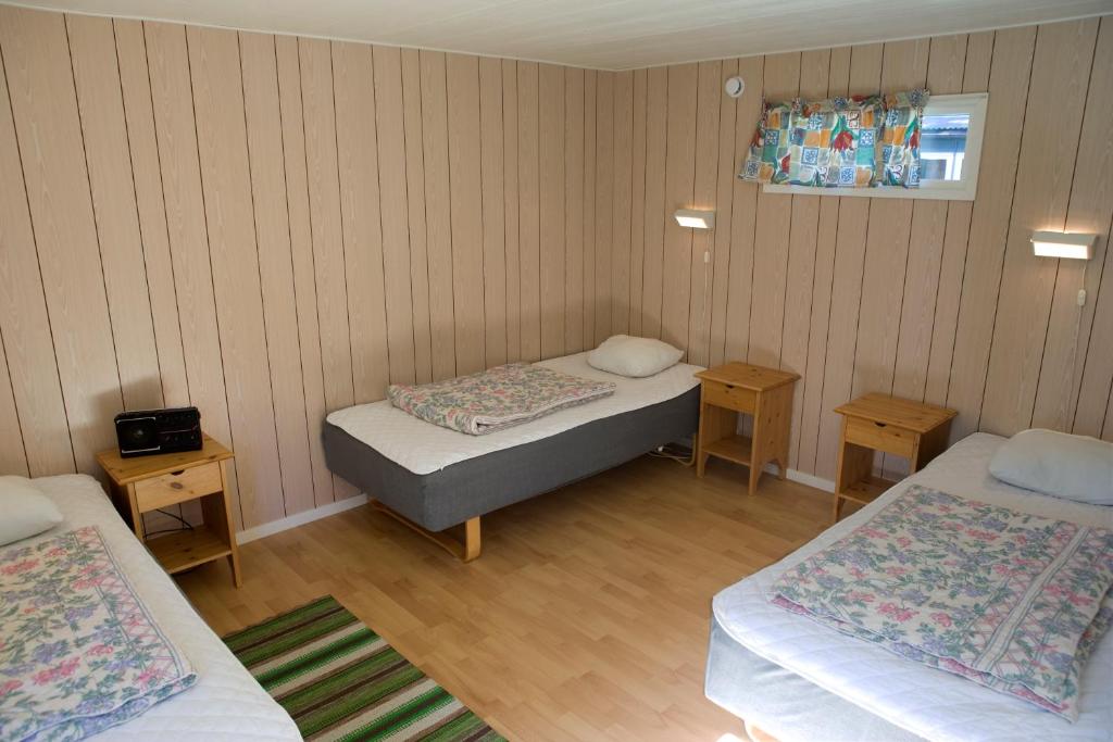 Postel nebo postele na pokoji v ubytování Åminne Fritid & Havsbad AB