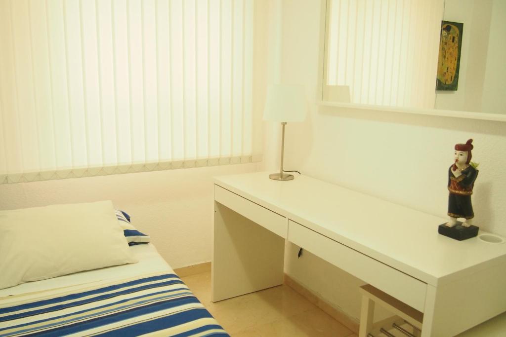 A bed or beds in a room at VERO Granada y PARKING en el edificio