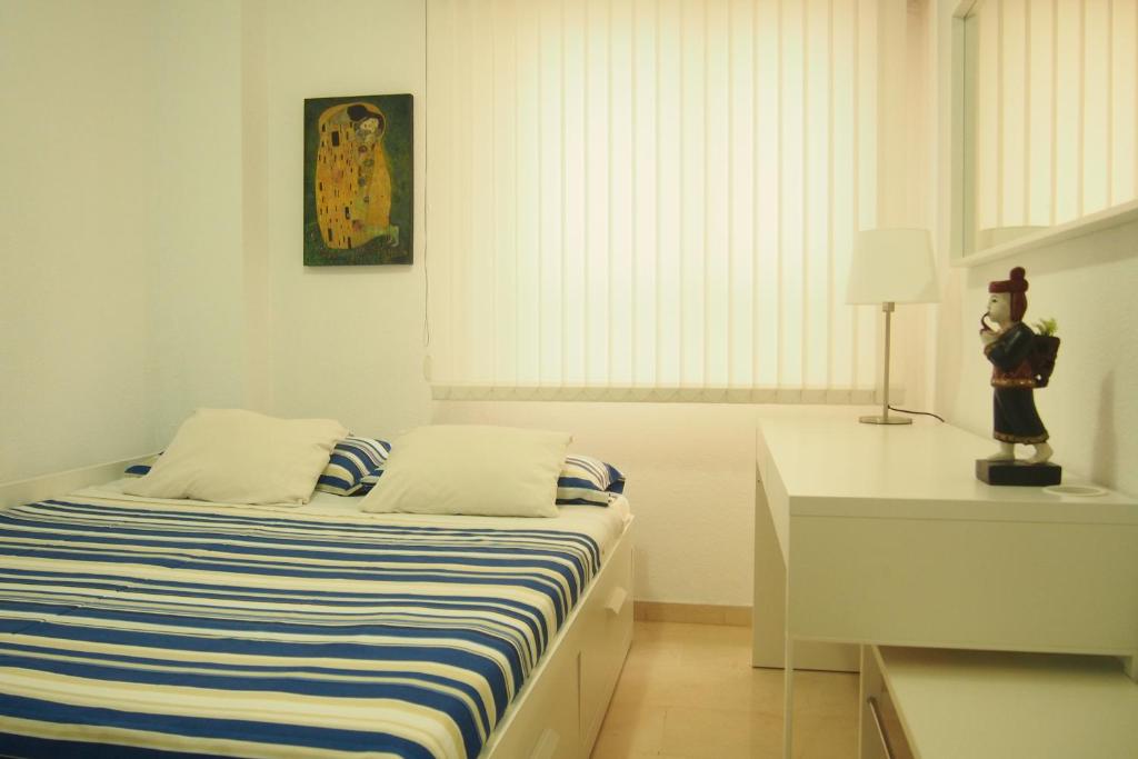 A bed or beds in a room at VERO Granada y PARKING en el edificio